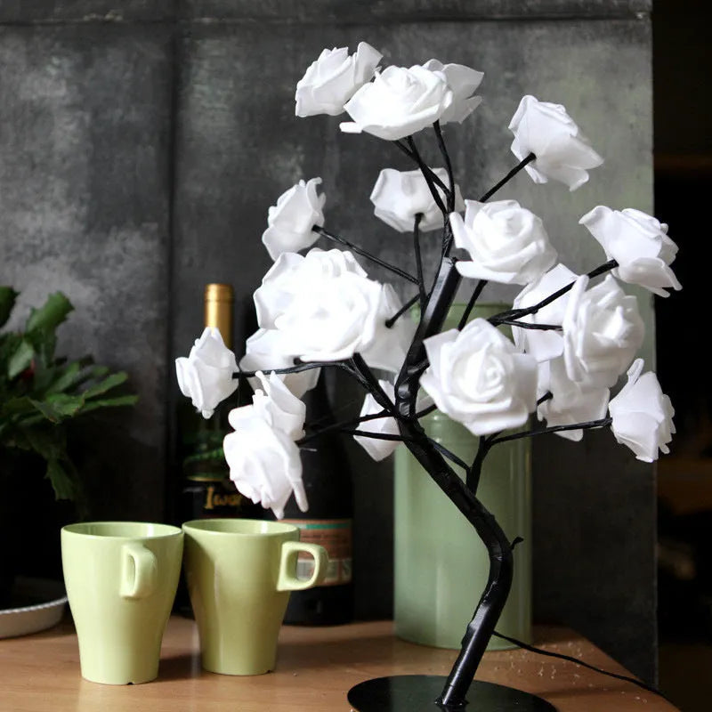White and red rose flower LED table lamp with bonsai tree lights on a table.