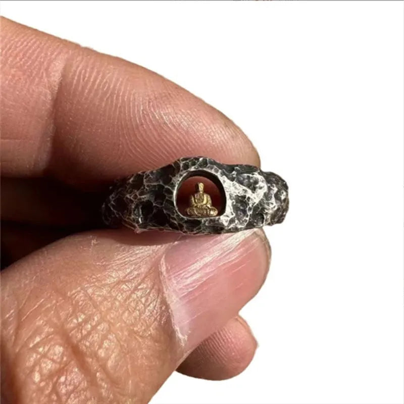 Hand-forged copper Grotto Buddha ring with rock texture on a size No. 8 finger.