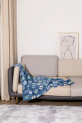 Blue Dog pattern double-sided flannel pet blanket folded to show size and cartoon design.