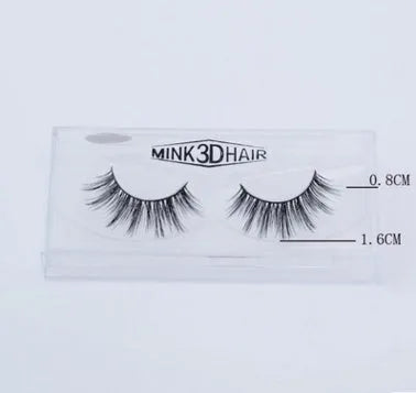 Pair of faux mink eyelashes with long tail and cotton stem against white background