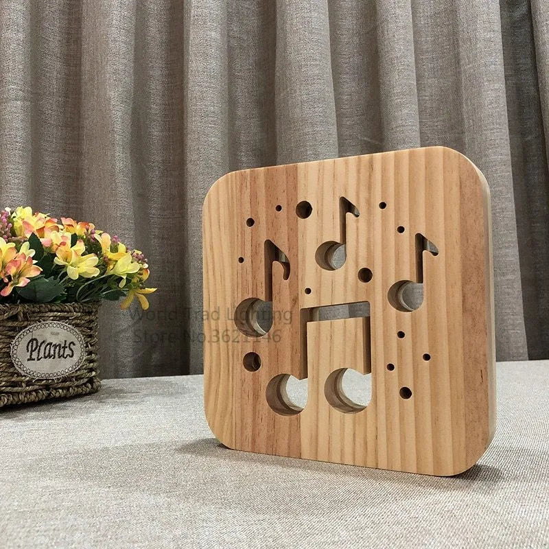Square pine wood USB LED atmosphere lamp emitting warm white light on a table.