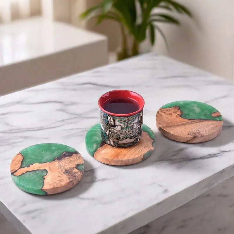 Wooden coaster with heat insulation resin in round tumour green colour on a table.