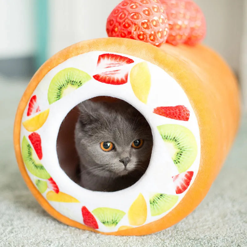 Yellow cake roll shaped plush cat toy with short plush fur on a neutral background