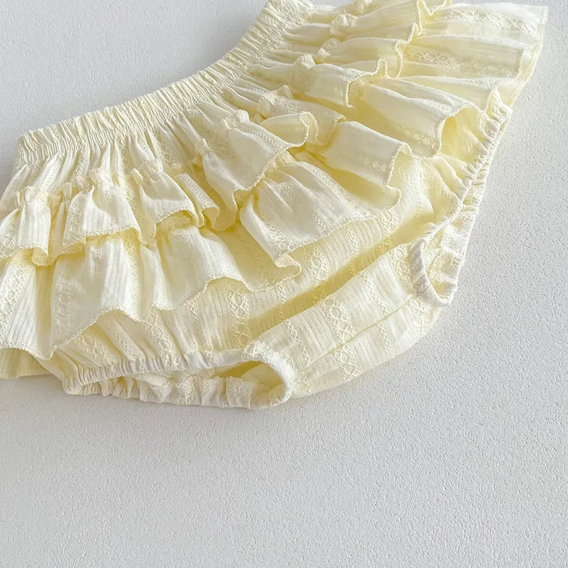 Beige cotton girls double layer bud-waisted shorts set with ruffled collar top on white background