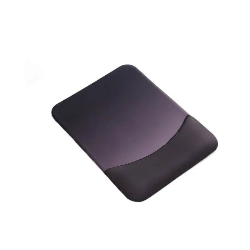 Square black silica gel wrist rest mouse pad on a desk, showing cloth surface and raised support pillow.