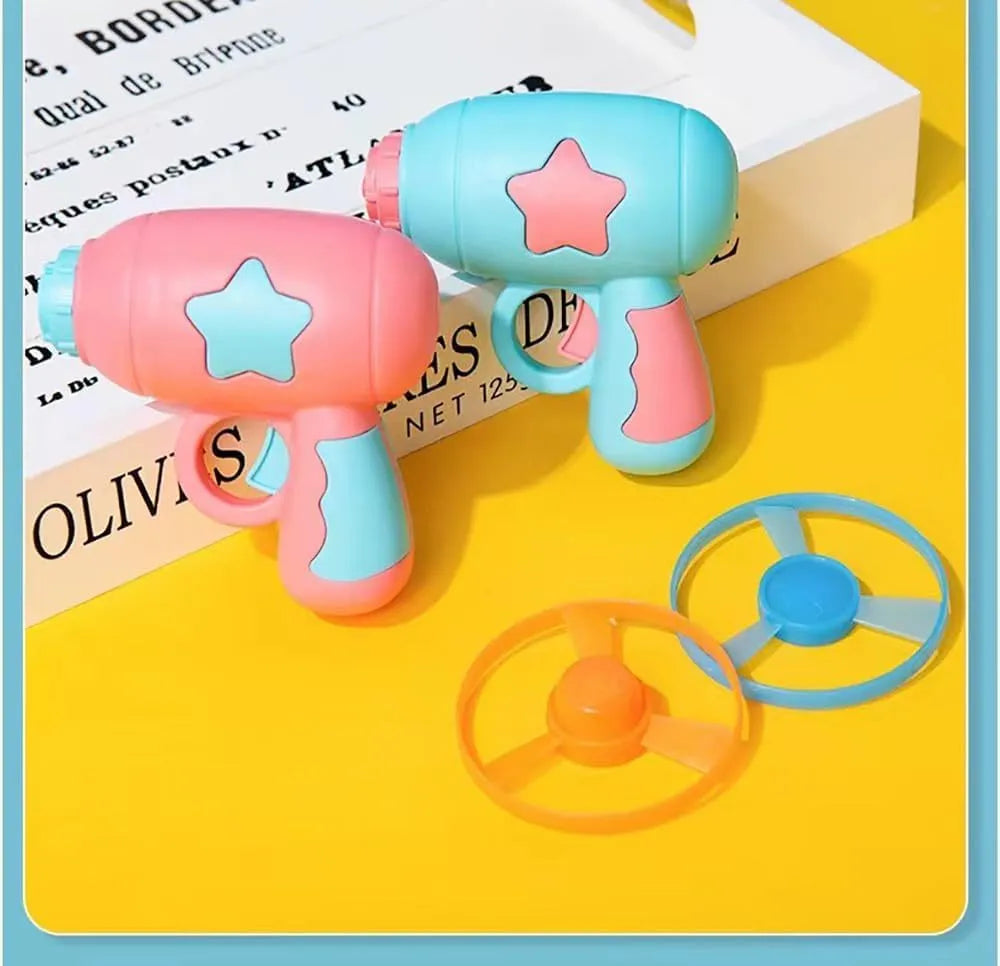 Blue interactive cat toy gun with plastic Frisbee on launch mechanism for indoor hunting play