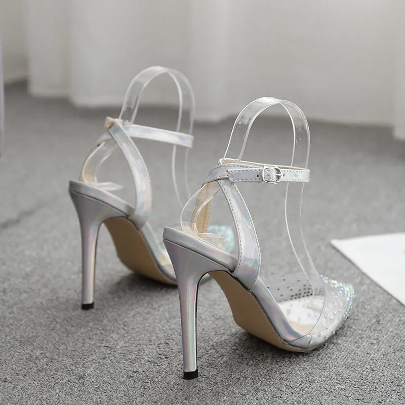 Women's pointed toe sandals with stiletto heel and diamond detail on the footbed.