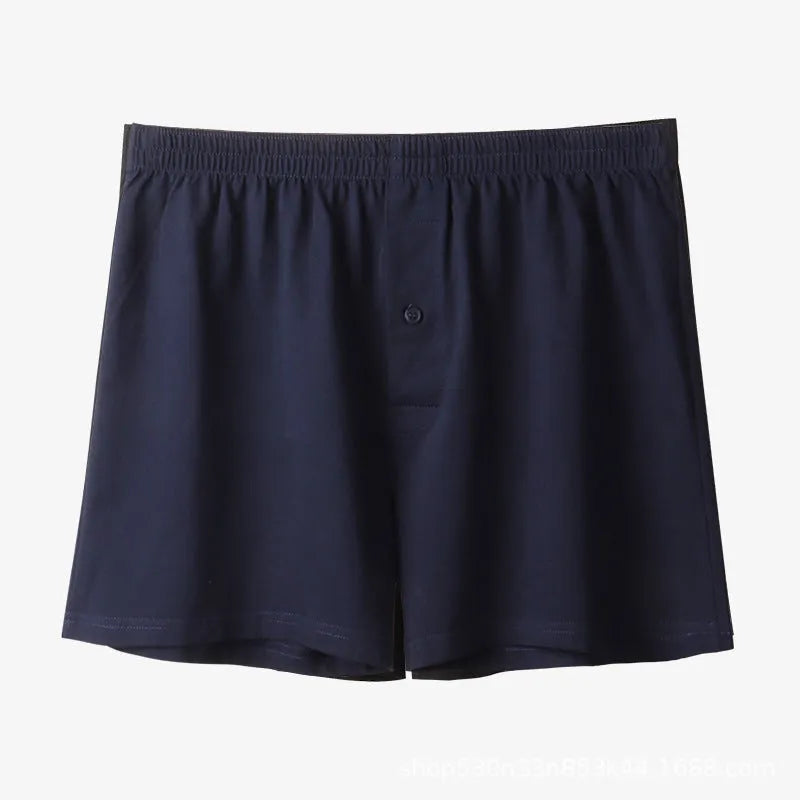 Men's solid colour cotton boxer shorts on a white background, showing loose fit and high waistband.
