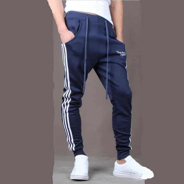 Men's straight leg cotton casual trousers with three-bar side stripe in grey, black, and navy