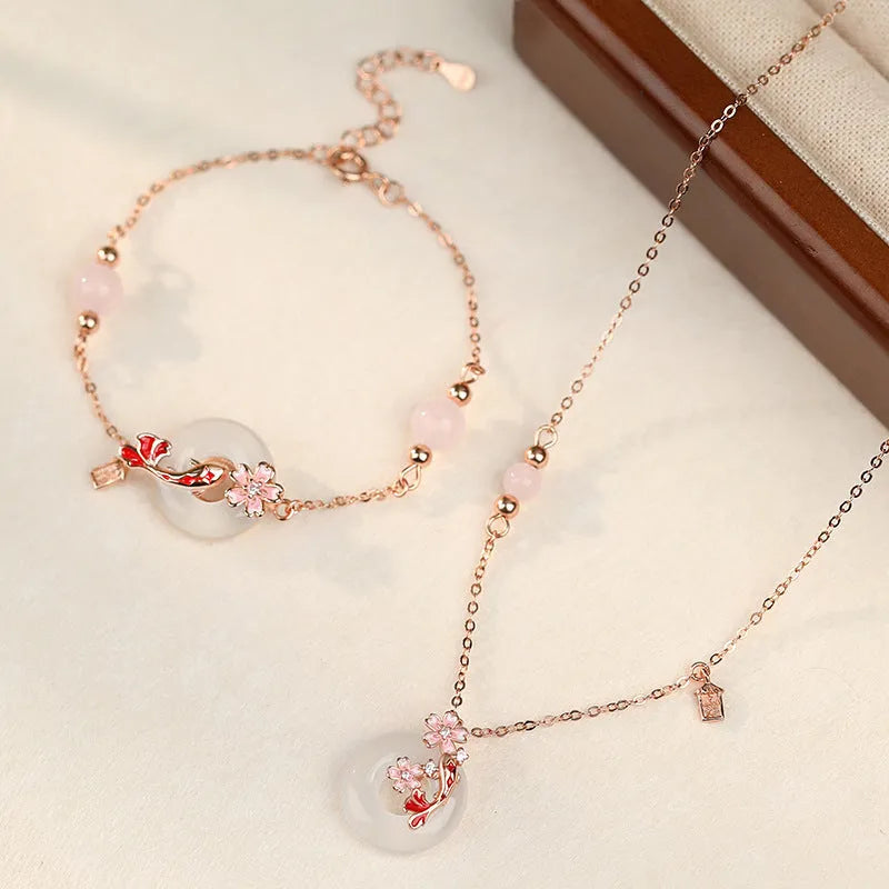 S925 sterling silver bracelet with white chalcedony crystals and a floral koi design.