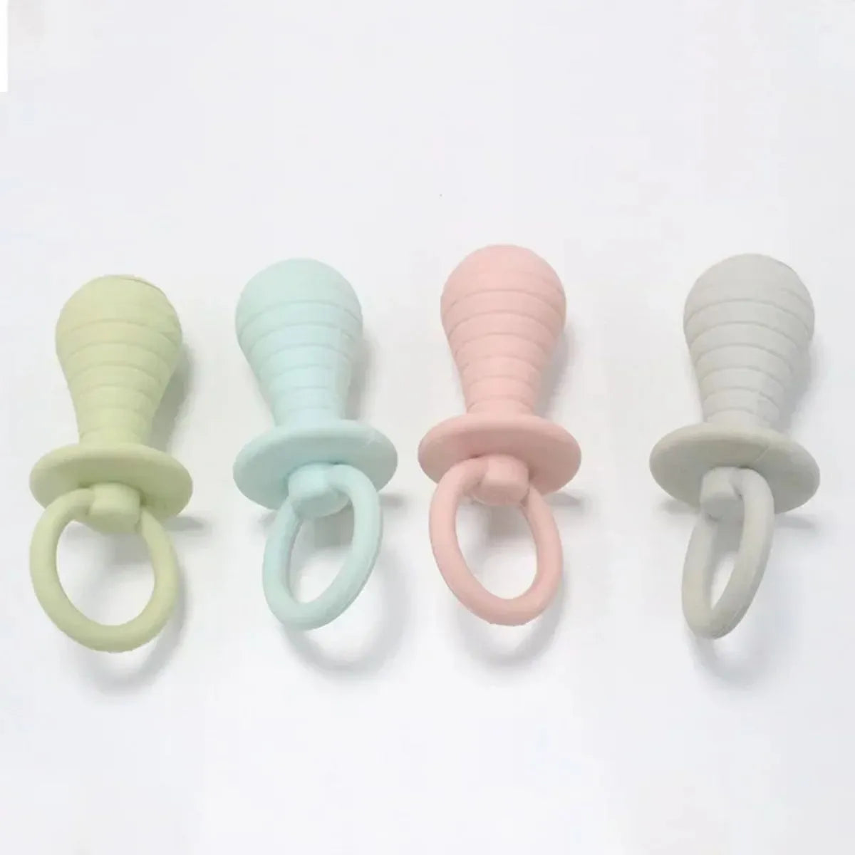Four coloured pet pacifier rubber chew toys with squeakers for puppies and kittens