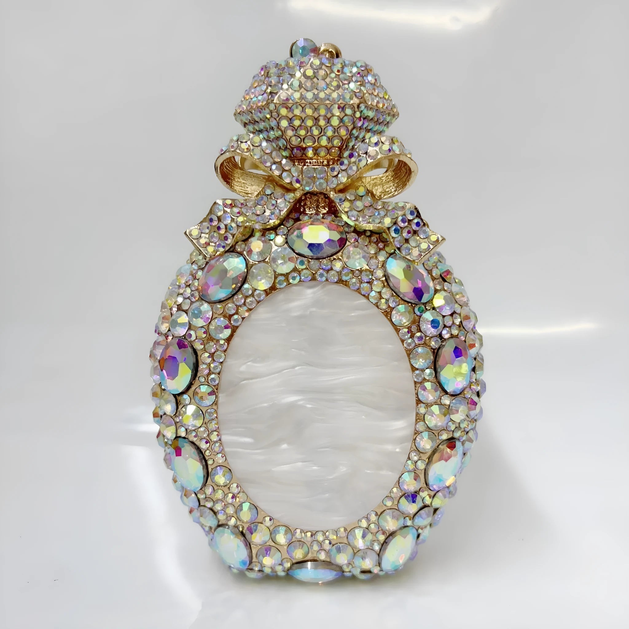 Women's alloy clutch bag with hard-shell construction in metallic finish