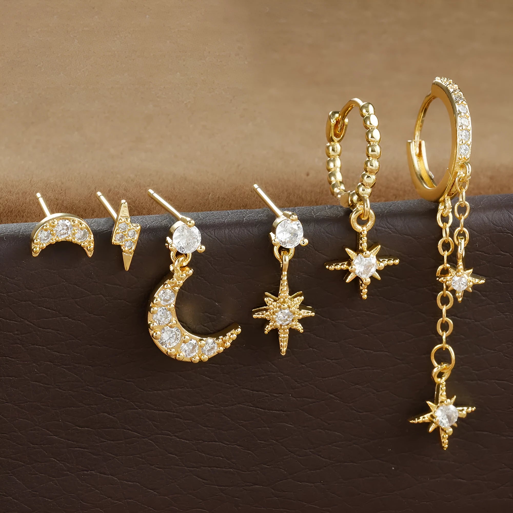 XINGX gold electroplated chain tassel earrings with zircon studs, six-piece set showing three complete pairs