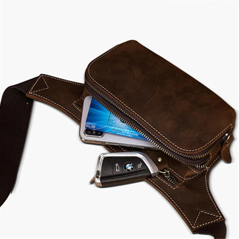 Brown genuine cowhide men's sports waist bag with pull closure showing internal mobile phone pocket