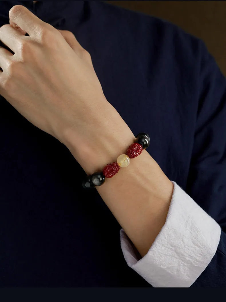 Carved cinnabar bead bracelet with animal zodiac design in gold or silver colour options