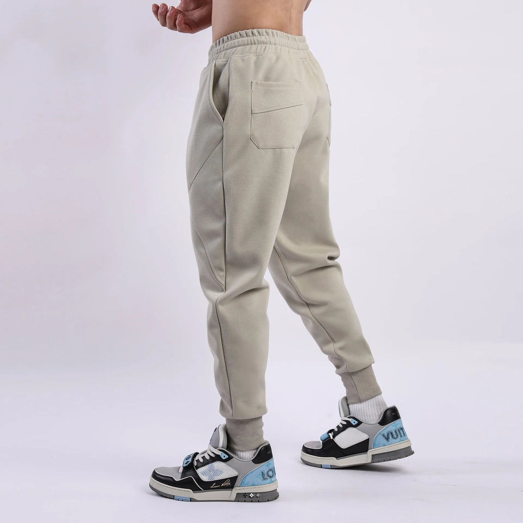 Men's ankle-tied drawstring sweatpants in polyester cotton, available in five colours and sizes M to XXXL