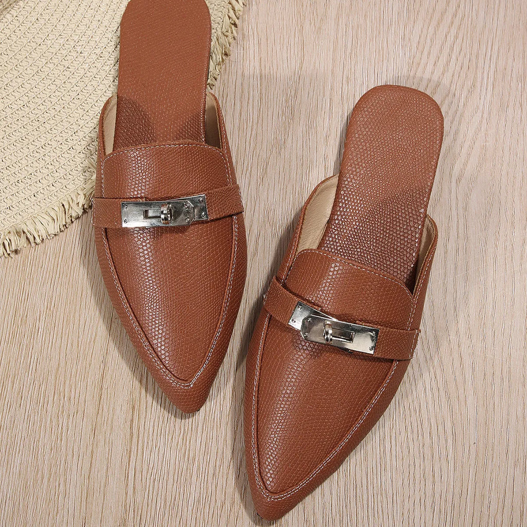 Light brown women's pointed toe slippers with a low heel, showing PU upper and rubber sole.