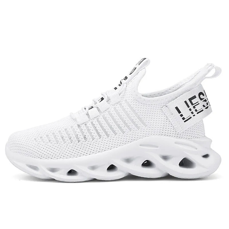 Kids casual black fabric sneakers with Velcro strap and lightweight EVA sole.
