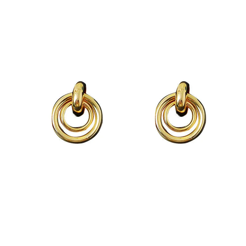 A pair of women's geometric round ring earrings with an irregular shape in a gold electroplated finish.