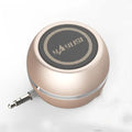 A5 portable mini speaker in red with 3.5mm audio plug and ABS plastic casing on a table