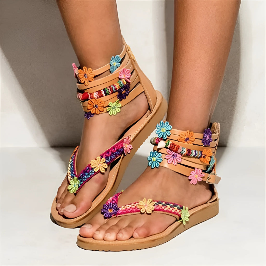 Beige ethnic Roman sandals with flat sole, round toe, and decorative beaded petals.