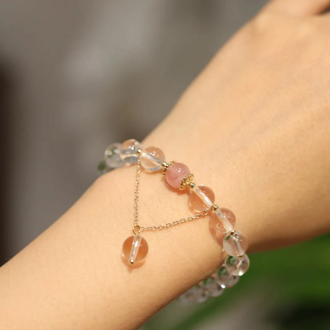White crystal bracelet with geometric Chinese auspicious patterns and cat eye obsidian detailing