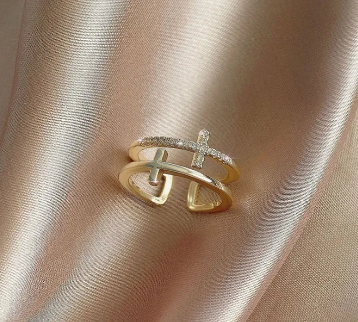 Adjustable copper ring with clear zircon stone in geometric setting, shown in gold electroplated finish