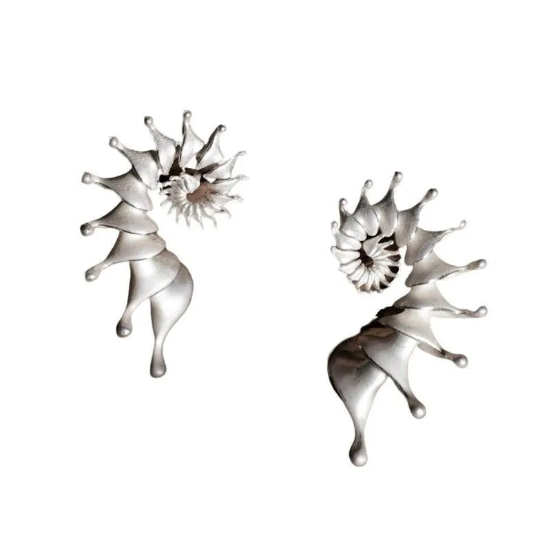 Three-dimensional matte finish conch shell stud earrings with exaggerated silhouette and simple styling