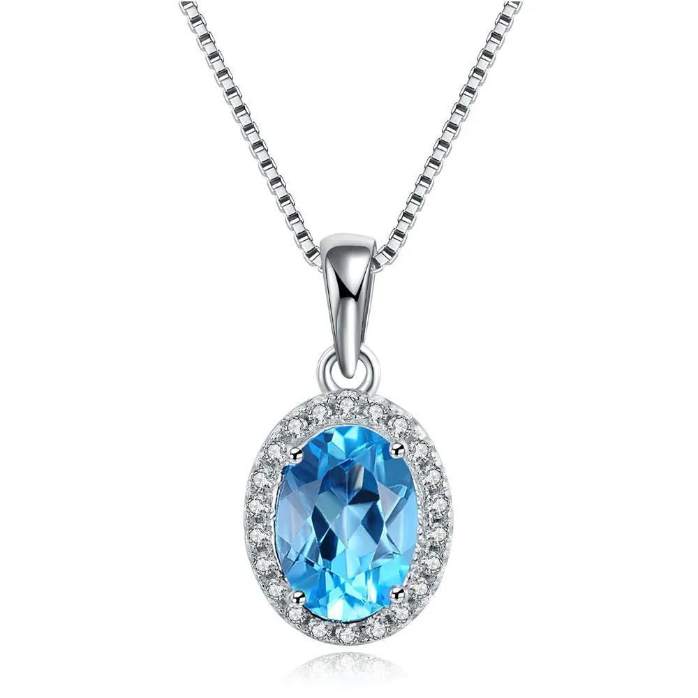 925 Sterling Silver four-piece jewellery set with Blue Topaz gemstones including earrings, ring, pendant and necklace
