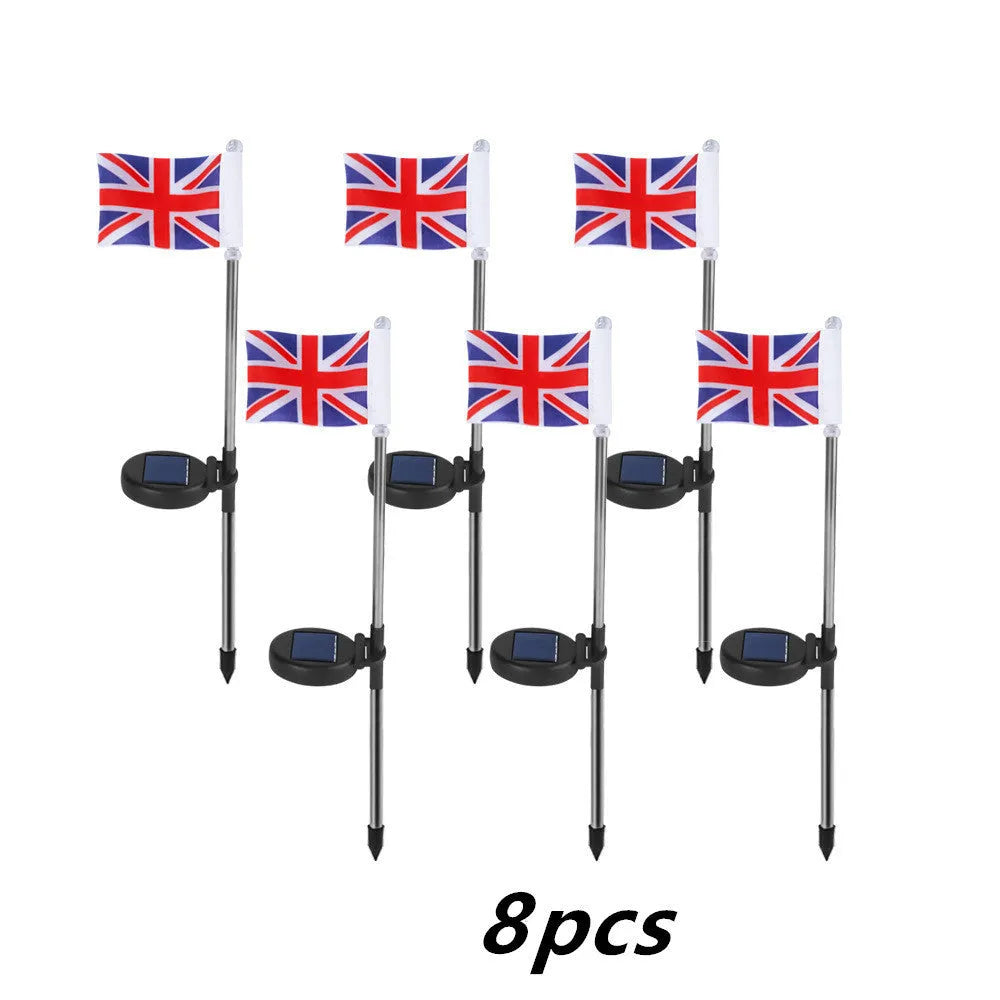 Solar-powered stainless steel garden flag light showing American flag design with white LEDs illuminated.