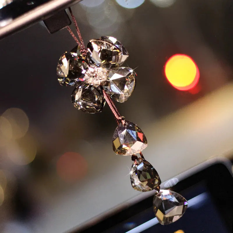 Crystal Four Leaf Grass car pendant hanging, showing its approximately 20cm size and transparent finish.