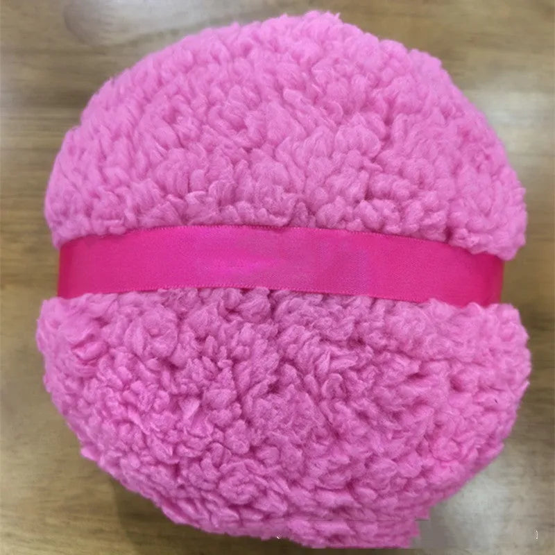 Oversized plush dry powder puff makeup applicator measuring 150x75mm in pink, white, and skin colour options