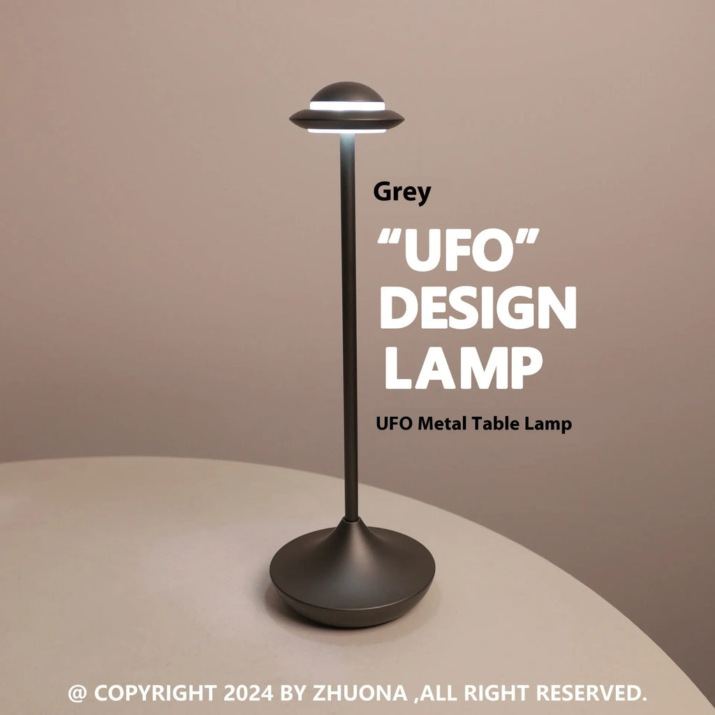 Black UFO-shaped metal table lamp with rechargeable battery and touch dimming controls.