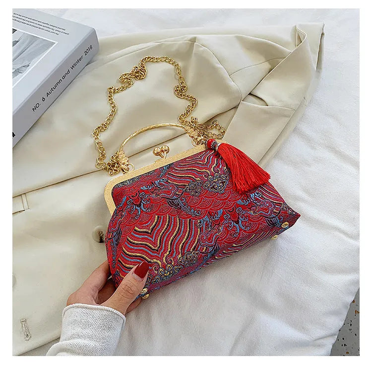 Chinese embroidery cheongsam handbag in polyester with shell shape and internal zipper compartment