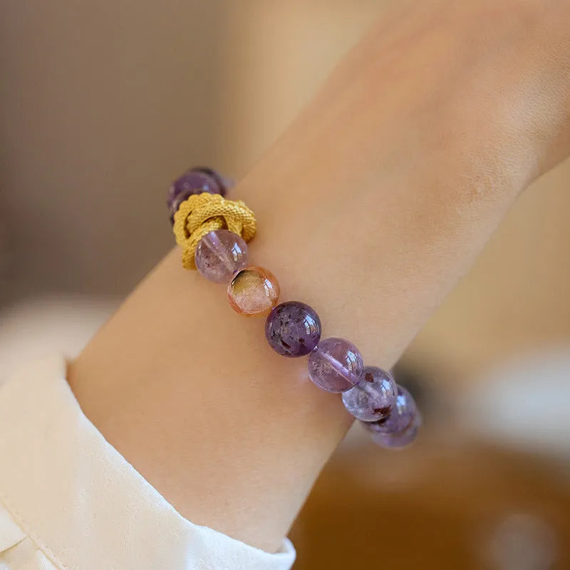 Purple ghost stone nine purple good luck crystal bracelet with 10mm beads and animal zodiac design.