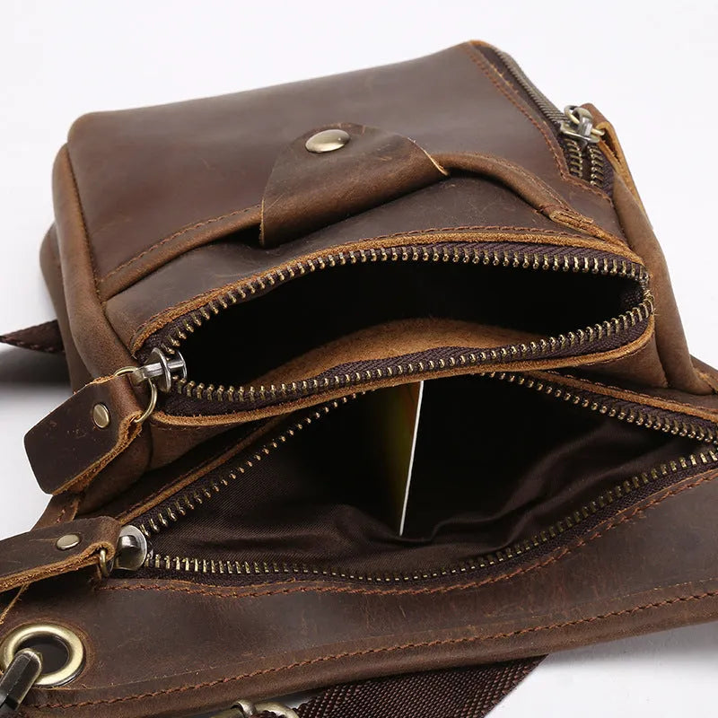 Men's brown crazy horse leather vintage satchel bag with flap closure and adjustable shoulder strap.