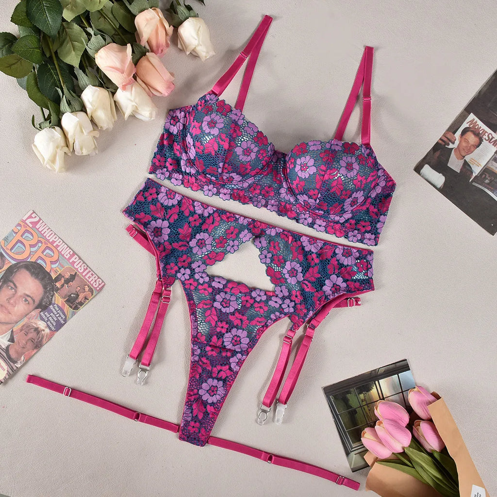 Rose red women's bikini swimwear set with embroidered contrast colour detail on mannequin
