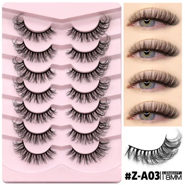 Box of natural style false eyelashes made from artificial fibre, showing thick dense lashes.