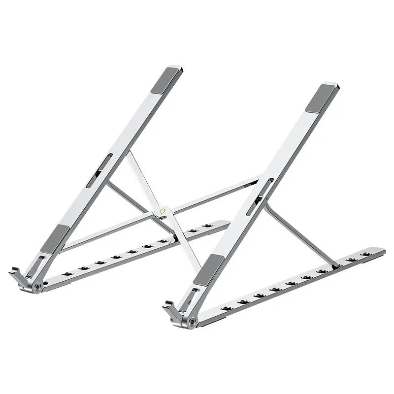 Folding flat aluminium alloy laptop bracket stand in silver with silicone pads, set at an angled position on a desk