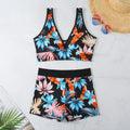 Women's two-piece printed boxer swimsuit set in a multi-colour pattern, showing sleeveless top and briefs.