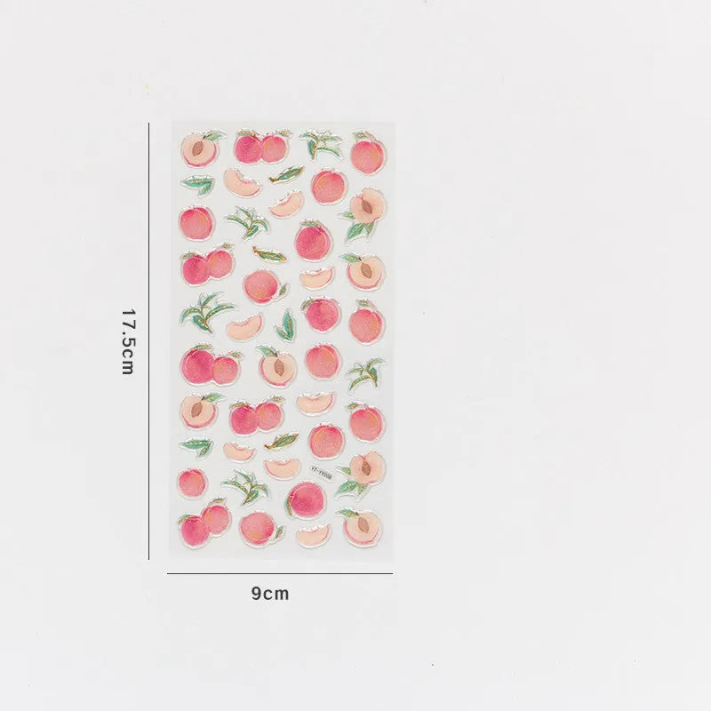 Sheet of six DIY fruit bronzing stickers showing grape, orange, passion fruit, peach, pineapple and strawberry designs.