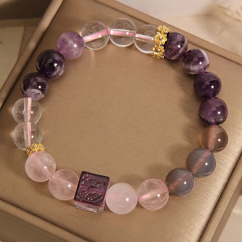 Women's purple amethyst crystal bracelet with rhinestone details measuring 10mm
