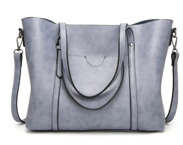 Brown retro-style women's PU leather messenger bag with a top handle and long shoulder strap.