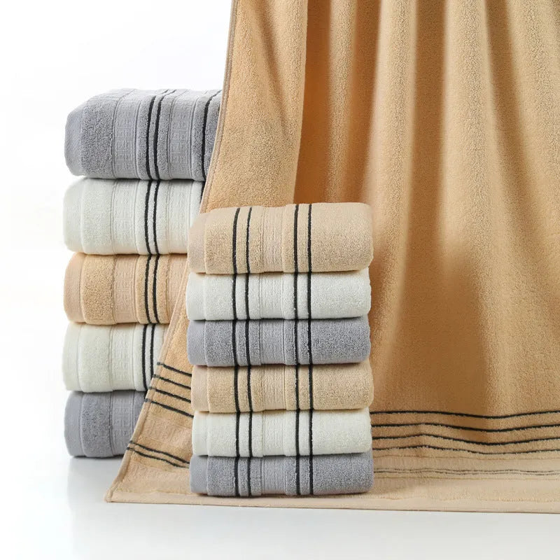 Pure cotton bath towel set with one large towel and two hand towels in neutral colours.