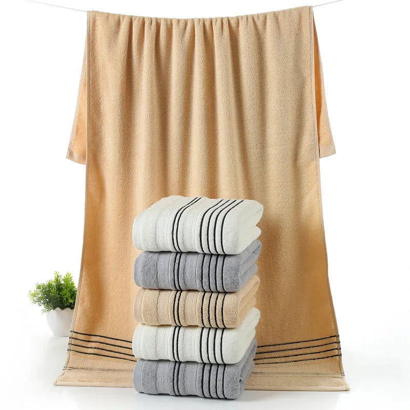 Pure cotton bath towel set with one large towel and two hand towels in neutral colours.