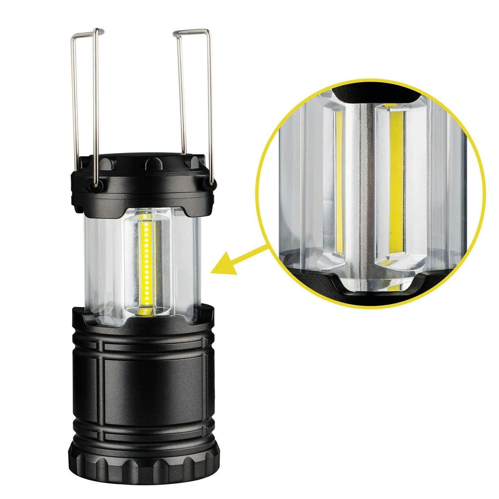 COB LED camping lantern in black, telescopic with hook, on outdoor background