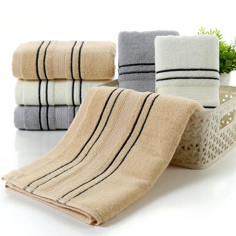 Pure cotton bath towel set with one large towel and two hand towels in neutral colours.