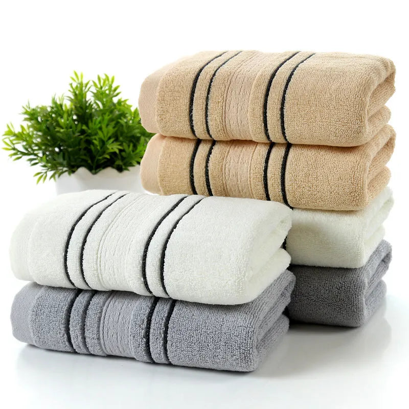 Pure cotton bath towel set with one large towel and two hand towels in neutral colours.