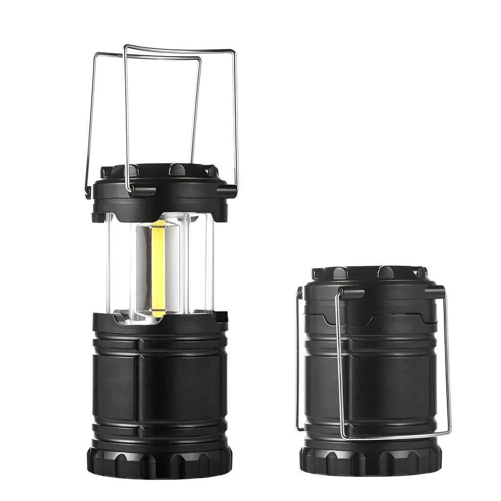 COB LED camping lantern in black, telescopic with hook, on outdoor background