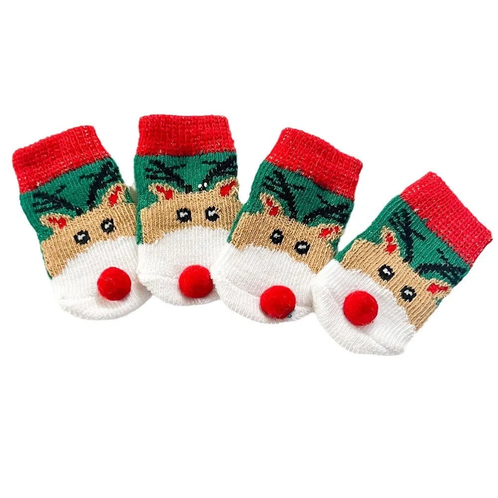 Set of four Christmas dog socks with Santa Claus and elk cartoon patterns in blue and red colours